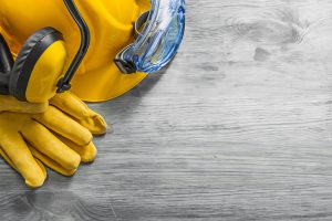 Picture of yellow hard hat and yellow gloves